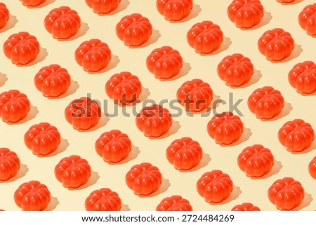 Creative summer abstract tomato pattern flat lay on pastel yellow background minimalism