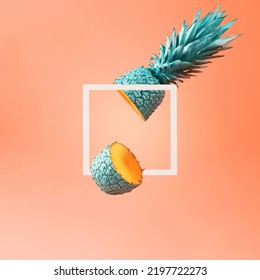Creative summer layout of a frame and a cut pineapple on an orange background.  - Shutterstock ID 2197722273