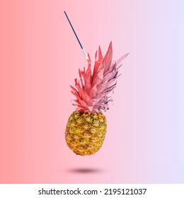 Creative summer layout made pineapple and pink   purple leaves   painting brush against pastel gradient background  Original pineapple decoration  Creative summer idea  Fruit concept 