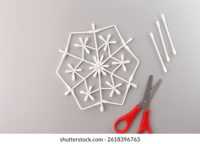 Creative symmetry in everyday objects, white cotton swabs arranged in a snowflake like hexagonal pattern. Useful for education, design, DIY or sustainability-focused activities, - Powered by Shutterstock - Get 15% off with code: PIKWIZARD15