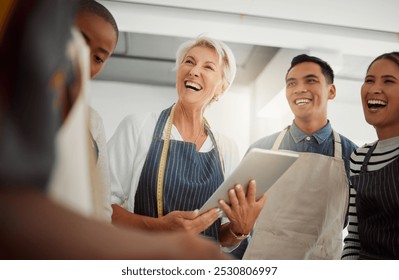 Creative, tablet and discussion for group, fashion designer and planning in workshop, talking and ideas. Tailor, teamwork and people in business meeting, laughing and conversation in design studio - Powered by Shutterstock