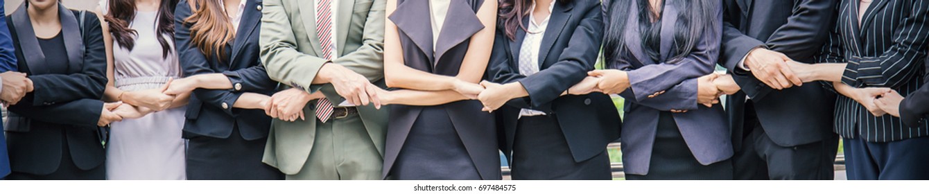 Creative team meeting hands together in line, asian business people teamwork acquisition, brainstorm concept. Startup friends creative people sale project panoramic banner - Shutterstock ID 697484575