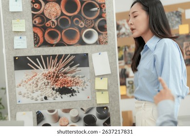 Creative team presenting eco friendly packaging ideas in a modern office, focusing on sustainable materials, textures, and product design concepts.