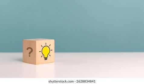 Creative thinking, creative, idea, problem solving, innovation. Wooden cube with idea light bulb and question side of the process of thinking, inspiration, idea. Success business