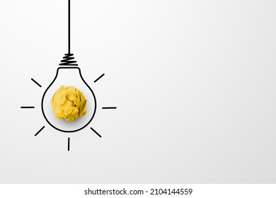 Creative thinking ideas and innovation concept. Paper scrap ball yellow colour with light bulb symbol on white background