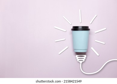 Creative Thinking Ideas And Innovation Concept. A Ball Of Takeaway Coffee Cup With A Light Bulb Symbol On A Purple Background. Time For Coffee.