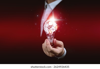 Creative thinking process concept. Businessman hold light bulb with gear icon. Meaning of excellent ideas, innovative design, and new inspiration in self-learning