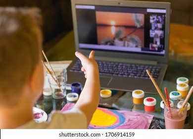 Creative toddler boy is creativity and the artist in an online drawing paints lesson. Childrens creativity. The concept of distance learning online school for the period of global quarantine.