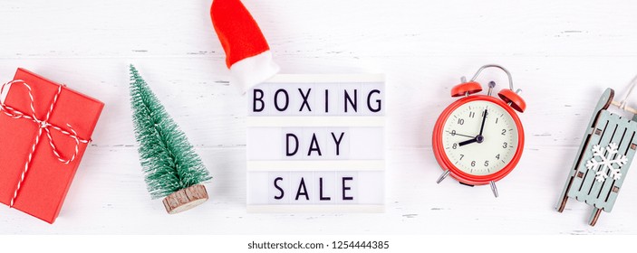 Creative Top view flat lay promotion composition Boxing day sale text on lightbox white background copy space Template Boxing day sale mockup winter christmas seasonal offer promotion advertising - Powered by Shutterstock
