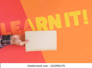 creative top view of hand holding a book isolated flat lay creative concept learn it text