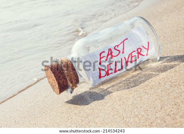 Creative transportation concept. Message in a\
bottle with text.
