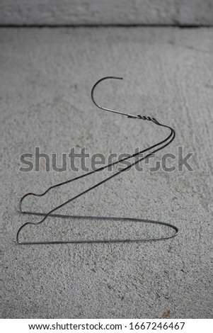 creative use of wire hanger forming it to the shape of a bird