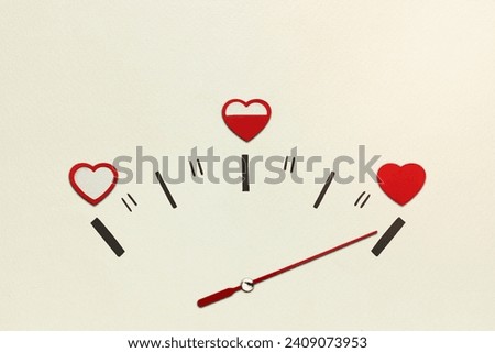Creative valentines concept photo of speedometer with hearts on grey background.