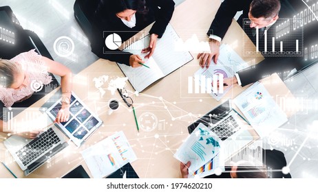 Creative visual of business people in corporate staff meeting . Concept of digital technology for marketing data analysis and investment decision making . - Shutterstock ID 1974620210