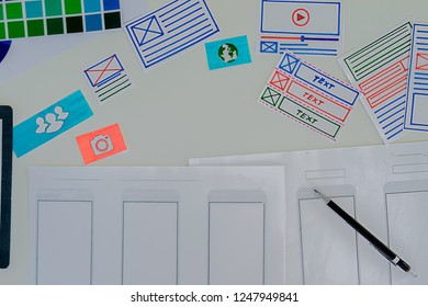 Creative Web Designer planning application and developing template layout, framework for mobile phone. User experience (UX) concept.
