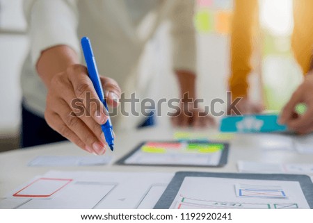 Creative Web Designer planning application and developing template layout, framework for mobile phone. User experience (UX) concept.