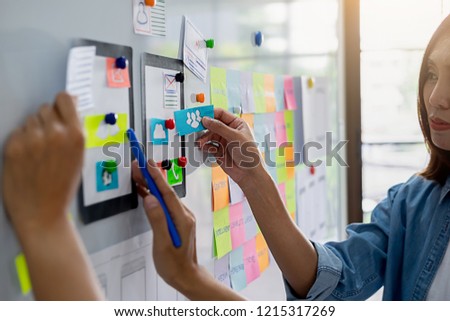 Creative Web Designer planning application and developing template layout, framework for mobile phone. User experience (UX) concept.
