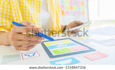 Creative Web Designer planning application and developing template layout, framework for mobile phone. User experience (UX) concept.