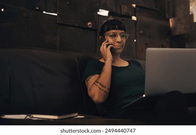 Creative, woman and phone call with laptop in workshop for consulting customer, inventory stock and metal production. Female worker, talking and digital for hardware development, information or craft - Powered by Shutterstock