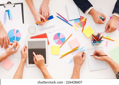 Creative Work. Top View Of Business People Working Together While Sitting At The Table