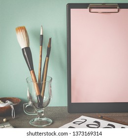 Creative workplace. Сlipboard with copy space blank mock up. Copy space