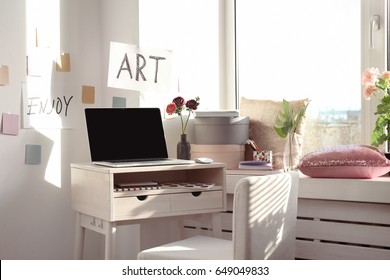 Creative workplace near windowsill in modern room