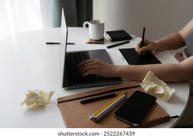 Creative Workspace with Crumpled Paper, Phone and Laptop - Powered by Shutterstock