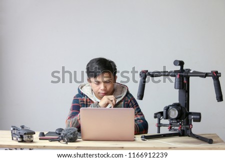 Creatives man are planning to create an ad or movie. Video and Travel Blog