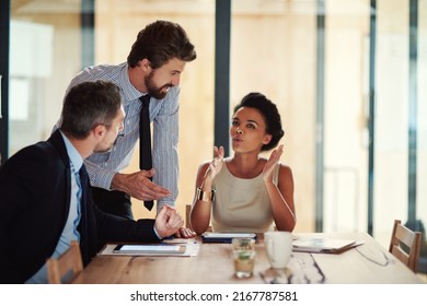 Creativity In Action. Shot Of A Group Of Colleagues Working Together In An Office.