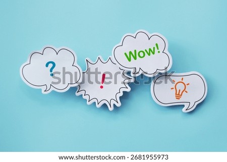 Creativity and brainstorming. Clouds with a question mark, an exclamation mark, the word "Wow!", and a light bulb as a symbol of creativity and ideas.