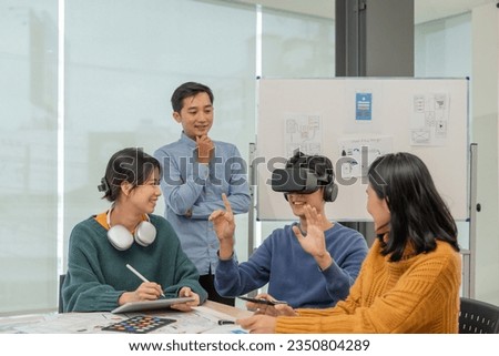 Creativity digital development .businessman use VR glasses virtual reality headset for ux developer and ui designer about mobile app interface at modern office