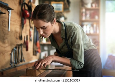 Creativity Is Her Middle Name. Shot Of A Young Female Designer In Her Workshop.