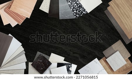 creativity house design ideas concept with sample of interior materials contains artificial stones, stone tiles, wooden veneer, fabric laminate, marble, vinyl flooring tiles placed on black marble. [[stock_photo]] © 