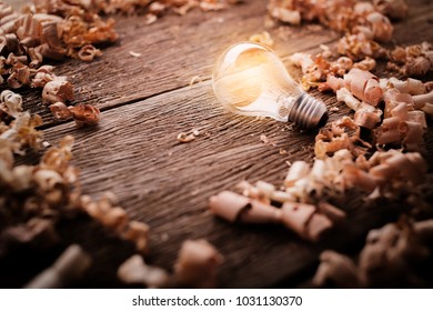creativity ideas concept with light bulb with wood sawdust on wooden texture table with free copy space for your creativity ideas text