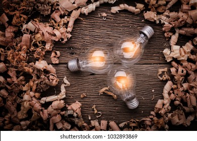 creativity ideas concept with light bulb with wood sawdust on wooden texture table with free copy space for your creativity ideas text
