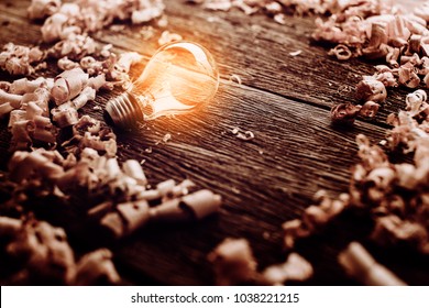 creativity ideas concept with light bulb with wood sawdust on wooden texture table with free copy space for your creativity ideas text