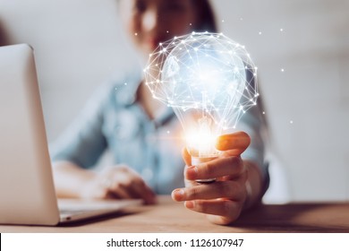 Creativity and innovative are keys to success.Concept of new idea and innovation with Brain and light bulbs. - Shutterstock ID 1126107947