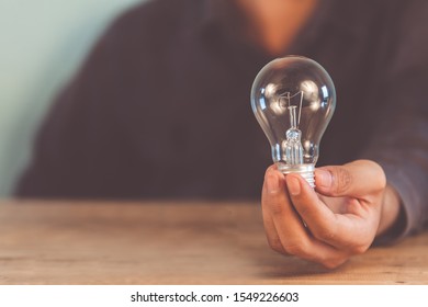 Creativity and innovative are keys to success.Concept of new idea and innovation with Brain and light bulbs. - Shutterstock ID 1549226603