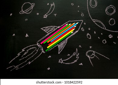 Creativity learning. Rocket ship launch made with pencils. Start up. space drawing on blackboard