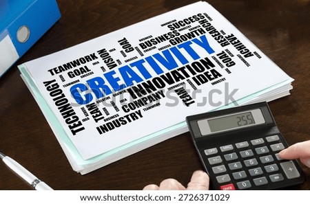 Creativity word cloud concept illustrated on a paper with a calculator