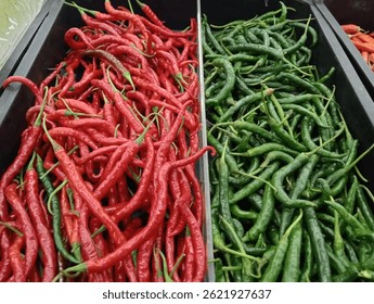 cred chili, chili price, red chili and green chili arranged on shelves in the Indonesian market.