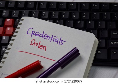 Credentials Stolen Write On A Book Isolated On Keyboard Computer