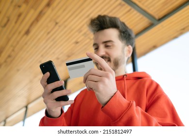 Credit Card, Adult Male Shopping Online Smiling Looking At His Phone, Smart Phone And New Generation Shopping