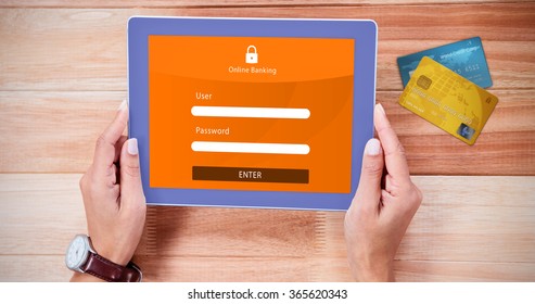 Credit Card Against Overhead Of Feminine Hands Using Tablet
