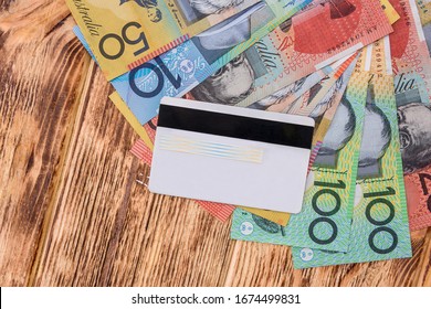 credit card with Australian dollars on the table