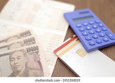 Credit card and bank passbook. Image of household budget, savings, and payment. - Shutterstock ID 1951350019