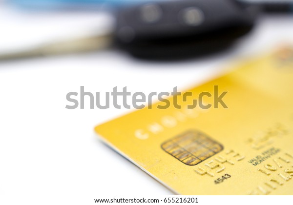 Credit card and car key on white background soft\
focus for pay on line\
concept