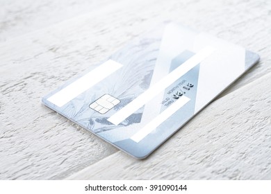 Credit Card Lying On A White Wooden Table