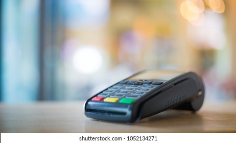 Credit Card Machine With Blurred Bokeh Background