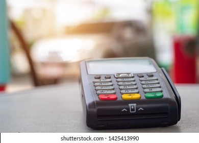 Credit Card Machine With Car Refueling Petrol At Gasoline Station In Background.
Credit Card Reader Payment, Buy And Sell Products & Service 
Credit Card Terminal Or EDC On Cashier Table.